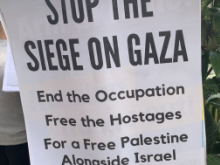 Placard saying "Stop the Siege on Gaza, End the Occupation, Free the Hostages, For a Free Palestine Alongside Israel"