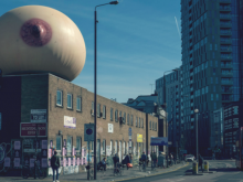 City buildings with giant breast