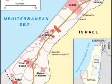 Map of the Gaza Strip showing major towns, refugee camps, crossing points, roads, and surrounding countries. The Mediterranean Sea lies to the west, Israel to the east, and Egypt borders the southern end near Rafah.
