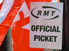 RMT official picket placard in front of red RMT flag