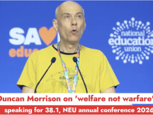 Duncan speaking at NEU conference