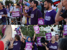 A two-panel photograph of a Standing Together demonstration. In the upper panel, demonstrators in purple Standing Together T-shirts hold signs and one person speaks through a megaphone. In the lower panel, a diverse group of demonstrators, including Palestinian and Jewish participants, hold purple signs in Hebrew and Arabic opposing settler violence and speak through megaphones.